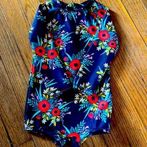 Toddler girl one piece swimsuit with long sleeves.